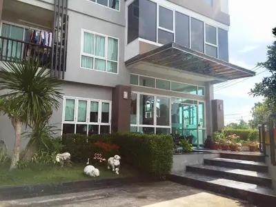 a house with three dogs sitting outside of it at Aonang Ocean View Studio ( The Sea Condo ) in Ao Nang Beach
