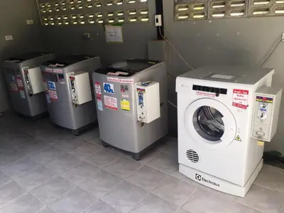 a row of washers and dryers in a room at Aonang Ocean View Studio ( The Sea Condo ) in Ao Nang Beach