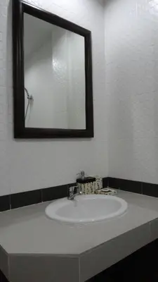 a bathroom with a sink and a mirror at Mellow Space Boutique Rooms in Karon Beach