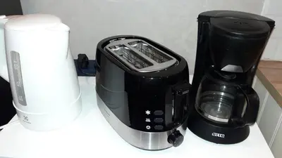 a blender and a coffee maker on a counter at The Title Residence NaiYang in Nai Yang Beach