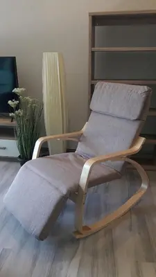 a wooden chair with a blanket on it in a room at The Title Residence NaiYang in Nai Yang Beach