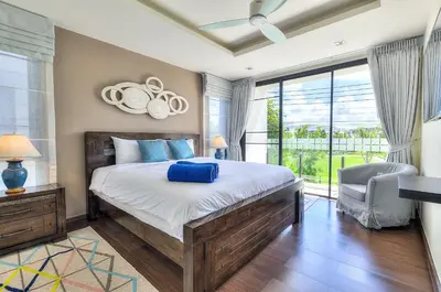 a bedroom with a large bed and a large window at 5bdr Pool Villa In Laguna Park #45 by Capital Pro in Bang Tao Beach