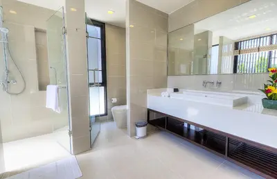 a bathroom with a large mirror and a sink at 5bdr Pool Villa In Laguna Park #45 by Capital Pro in Bang Tao Beach