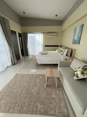 a living room with a bed and a couch at 5bdr Pool Villa In Laguna Park #40 by Capital Pro in Bang Tao Beach