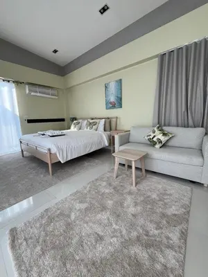 a bedroom with a bed and a couch at 5bdr Pool Villa In Laguna Park #40 by Capital Pro in Bang Tao Beach