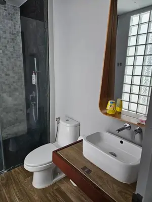 a bathroom with a toilet and a sink and a shower at Lucky Holidays in Saturdays Residence in Rawai Beach