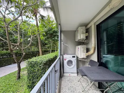 a washing machine on the balcony of a house at The Title Residencies Naiyang by Beringela in Nai Yang Beach