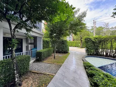 a house with a swimming pool in a yard at The Title Residencies Naiyang by Beringela in Nai Yang Beach