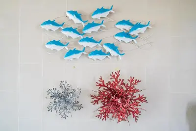 a wall with blue paper fish and coral on it at Apartment at Aristo Surin by Lofty in Surin Beach