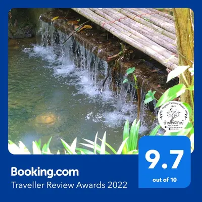 a waterfall rewards sign with a picture of a creek at Baan Rai Me Rak Organic Farmstay in Ban Pa Khlok