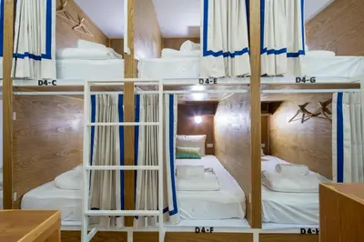 a room with four bunk beds in it at Hanuman VIP Hostel in Bang Tao Beach