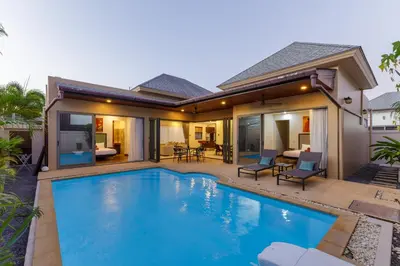 a swimming pool in front of a house at New Boutique Pool Villa Sequoia Close to Rawai and Naiharn Beach in Rawai Beach