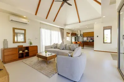 a living room with a couch and a table at New Boutique Pool Villa Sequoia Close to Rawai and Naiharn Beach in Rawai Beach
