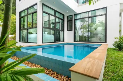 a swimming pool in the backyard of a house at 360 Degree Kamala Seaview Villa in Kamala Beach
