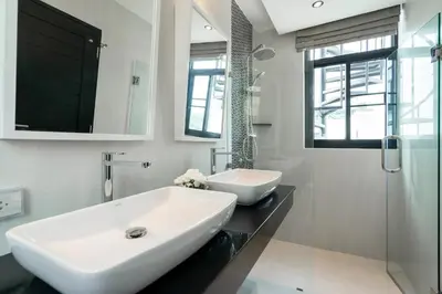 a bathroom with a large white sink and a shower at 360 Degree Kamala Seaview Villa in Kamala Beach