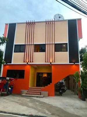a building with an orange and white at Golf House in Ban Bang Phai