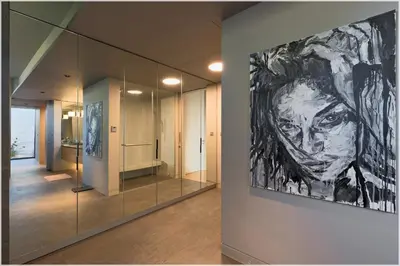 a painting of a woman on a wall in a hallway at The Cube Ocean View Pool Villa Kalim in Patong Beach