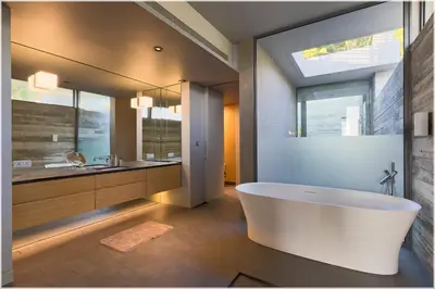 a bathroom with a large white tub and a sink at The Cube Ocean View Pool Villa Kalim in Patong Beach