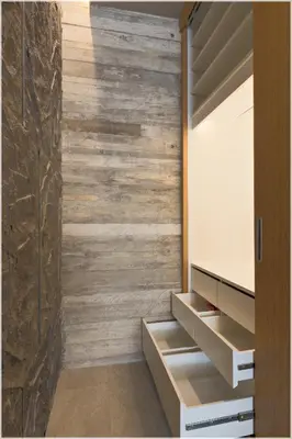 a room with a wooden wall at The Cube Ocean View Pool Villa Kalim in Patong Beach