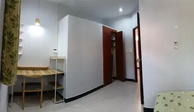 a room with a table and a bed and a hallway at 2BR Maryam villa near Tesco & beach. in Bang Tao Beach