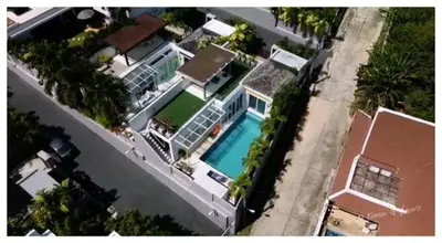 an overhead view of a large house with a swimming pool at Villa Kamala close to the beach in Kamala Beach