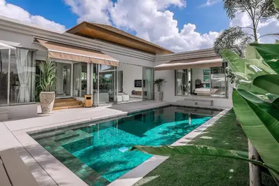 a swimming pool in the backyard of a house at Modern 3BR Villa with Private Pool and BBQ in Bang Tao Beach