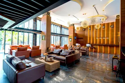a lobby with couches and tables and windows at Citygate Kamala Resort and Residence - Official Account in Kamala Beach