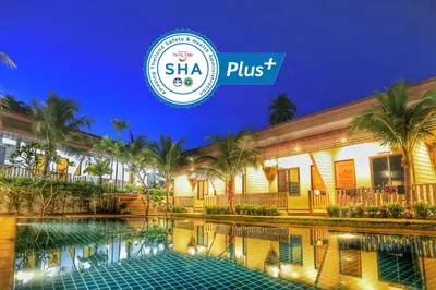 a hotel with a swimming pool at night at The Passion Nest - SHA Plus Certified in Phuket Town