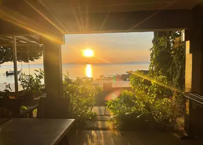 a view of the sunset from a house balcony at The Parlour Krabi in Klong Muang Beach