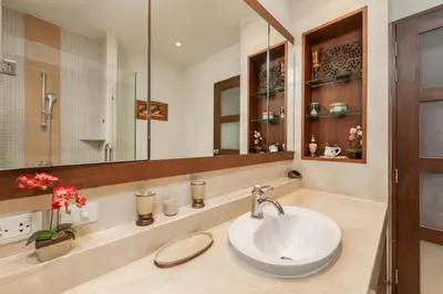 a bathroom with a sink and a mirror at VILLA LETI 22 meters Pool Naiharn Beach in Rawai Beach