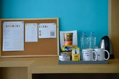 a counter with coffee cups and drinks on it at T2 Ao Nang Krabi in Ao Nang Beach
