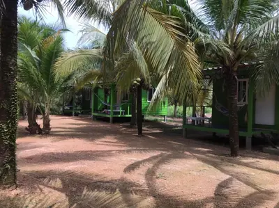 a resort with palm trees and a playground at Suan Proud Koh yao noi in Ko Yao Noi