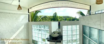 a large room with a large window with a view at Bang Mee Homestay Koh Yao Noi in Ko Yao Noi