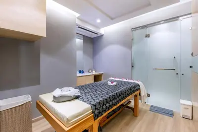 a bathroom with a shower and a bed in it at BlueSotel SMART Krabi Aonang Beach - Adults only in Ao Nang Beach