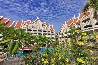 a resort with a pool in front of a building at Ayodhaya Palace Beach Resort - SHA Plus certified in Ao Nang Beach