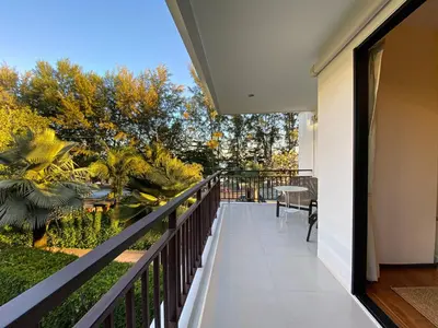 a balcony with a view of a garden at Title Rawai Phase III by Beringela in Rawai Beach