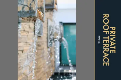 a water fountain on the side of a building at 3 BR Amazing Condo with Private Rooftop Pool in Kamala Beach