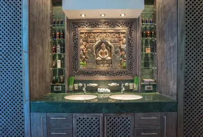 a bathroom with two sinks in front of a wall at Villa on The Rocks, 4 bedrooms, Phuket in Surin Beach