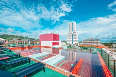 a swimming pool on the roof of a building at SLEEP WITH ME HOTEL design hotel @ patong (SHA Plus+) in Patong Beach