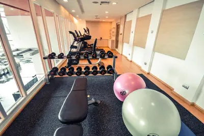 a gym with balloons and exercise equipment in a room at SLEEP WITH ME HOTEL design hotel @ patong (SHA Plus+) in Patong Beach