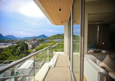 a balcony with a view of the mountains at Rocco Aonang Krabi in Ao Nang Beach