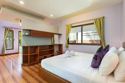 a bedroom with a large bed and a large window at Harmony Naturist Resort Rawai Phuket 18yr minimum age only nudist nake d FKK in Rawai Beach
