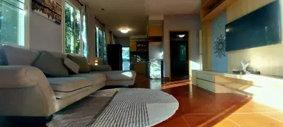 a living room with a couch and a rug at Harmony Naturist Resort Rawai Phuket 18yr minimum age only nudist nake d FKK in Rawai Beach