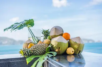 a pile of fruit sitting on a table at Oceanfront Beach Resort in Patong Beach