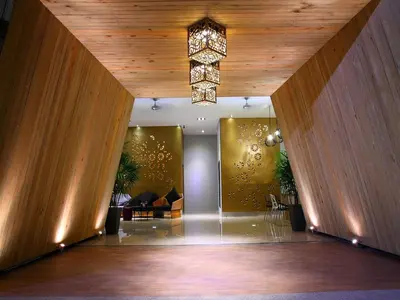 a lobby with a chandelier hanging from the ceiling at Icon Park Apartments - Kamala Beach in Kamala Beach