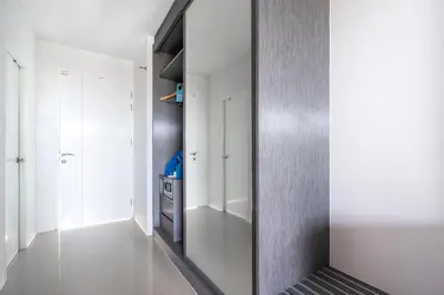 a mirror in a room with a hallway at The Thames Pool Access Resort & Villa - SHA Extra Plus in Chalong