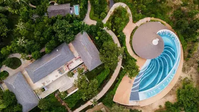 an overhead view of a swimming pool and a building at Island Escape Burasari in Phuket Town