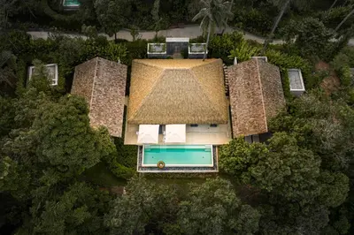 an overhead view of a house with a swimming pool at Island Escape Burasari in Phuket Town