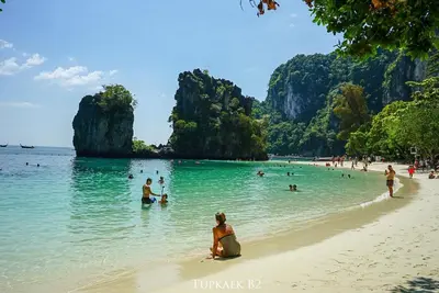 a group of people in the water at a beach at Thap Kaek B2 Villa in Klong Muang Beach