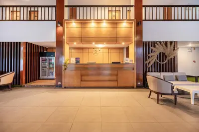 a lobby with a table and chairs in a building at Hotel COCO Phuket Bangtao Beach in Bang Tao Beach